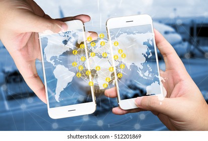 Two Businessman hands holding smartphones. Fintech concept , Peer-to-peer , logistic concept with map and world connect , airplane in airport blue background