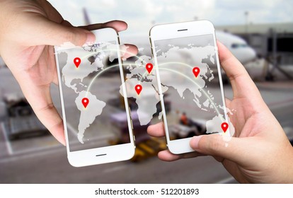 Two Businessman hands holding smartphones. Fintech concept , Peer-to-peer , logistic concept with map and world connect , airplane in airport blue background - Powered by Shutterstock - Get 15% off with code: PIKWIZARD15