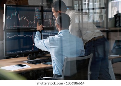 Two Businessman Working In Office Together, Pointing At Screen, Discussion And Checking Global Currency Index On Fund Exchange