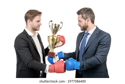 two businessmen in boxing gloves hold champion cup after battle for leadership, winner opponent.
