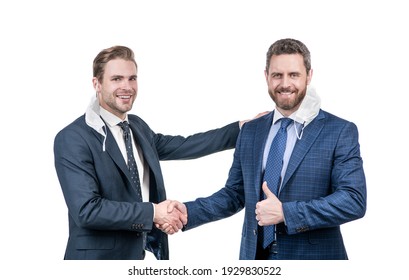 Two Businessmen Colleagues In Respirator Mask Shaking Hands After Successful Business Deal During Coronavirus Pandemic, Business Meeting.