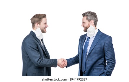 Two Businessmen Colleagues In Respirator Mask Shaking Hands After Successful Business Deal During Coronavirus Pandemic, Partnership.