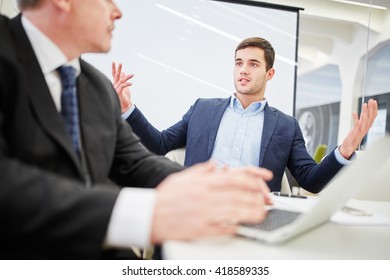 Two Businessmen In A Dialogue About Consulting In The Office