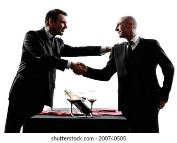 Two Businessmen Dinning Handshaking In Silhouettes On White Background