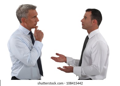 Two businessmen discussing.