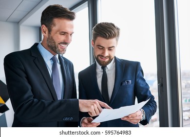 Two Businessmen Discussing At Office During Business Meeting