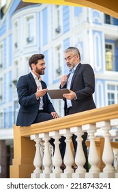 Two Businessmen Discussing A Project