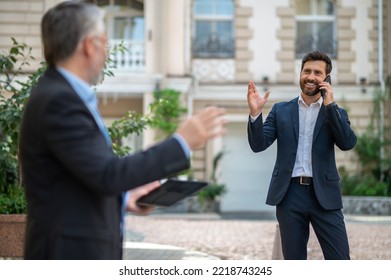 Two Businessmen Discussing A Project