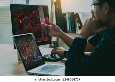 Two businessmen feel desperate about the crisis stock market, stock exchange market crypto trading decreasing chart data fall down loss, desperate about losing money of crisis, recession, inflation.