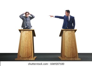 Two Businessmen Having Heated Discussion At Panel Discussion