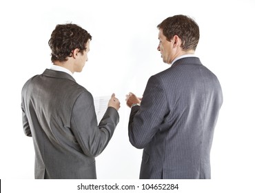 Two businessmen looking at documents