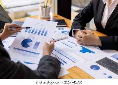Two businessmen are meeting together in the office, they are meeting the topic of finance and financial management, they are company partners. Concept of financial management for startup companies.