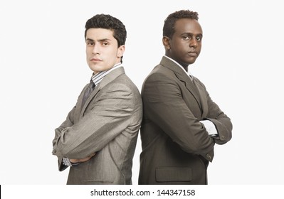 Two Businessmen Standing Back To Back