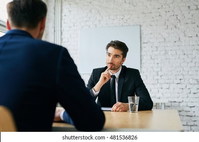 Two Businessmen Talking During Job Interview