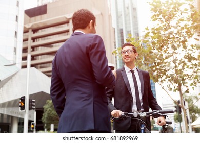 Two Businessmen Talking Outdoors