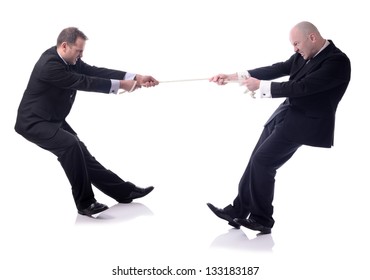 Two Businessmen In A Tug Of War Isolated On White Background