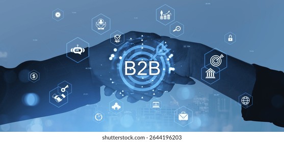 Two businesspeople shaking hands with B2B text overlay, surrounded by digital icons and light effects, on a blue background, symbolizing business partnerships
