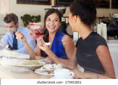 Two Businesswomen Meeting For Lunch In Coffee Shop