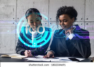 Two Businesswomen Work Together In Modern Office On New Project. Double Exposure. Concept Of Success. ICO Icon.