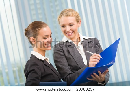 Two businesswomen working together at office