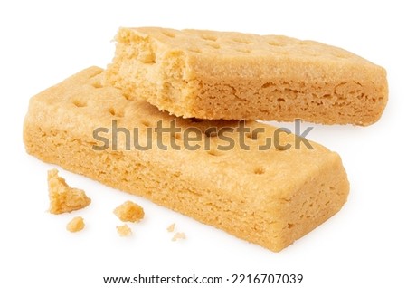 Two butter shortbread finger biscuits isolated on white. One partially eaten.