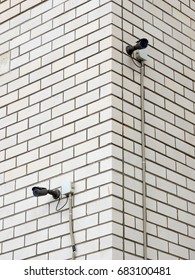 Two cameras installed on the corner of the building