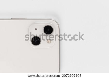 two cameras white smartphone on a white background. smart phone