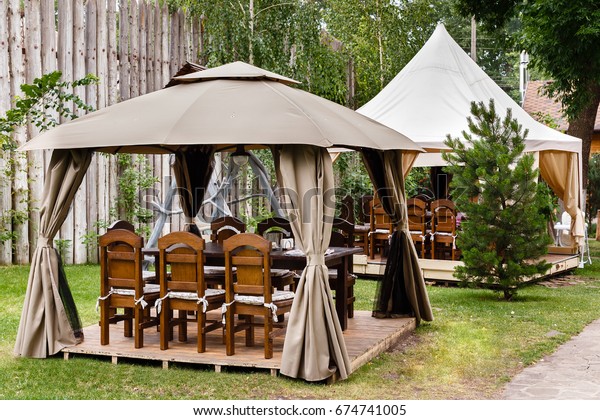 Two Canvas Tents Wooden Tables Chairs Stock Photo Edit Now