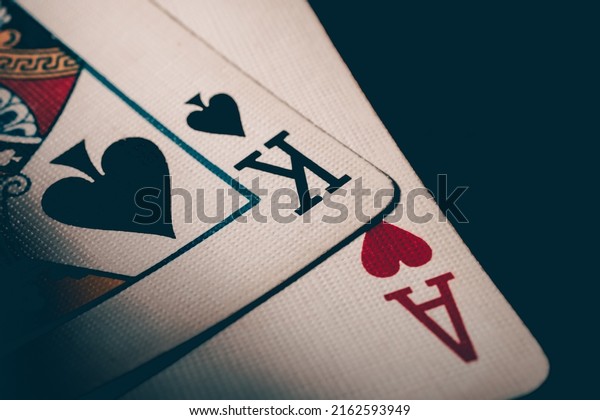 Two cards king of spades and ace of hearts. Ace and\
king poker cards. Nuts hand to win. Luck in the game of blackjack.\
High quality photo