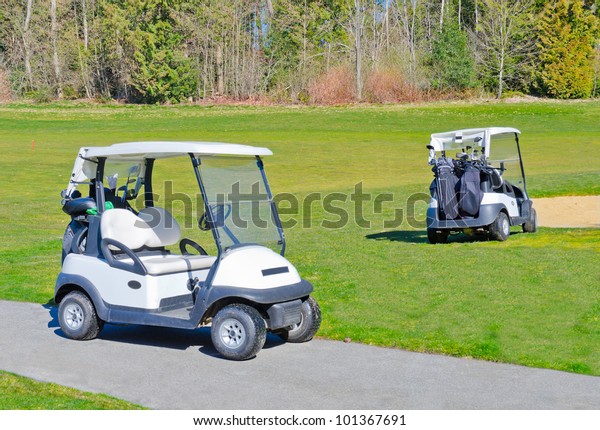 Two carts on the golf\
course.