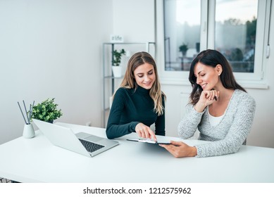 Two Casual Business Women At Work.