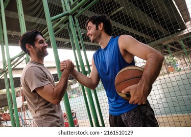 Two causian basketball player resting and ralax.  - Powered by Shutterstock