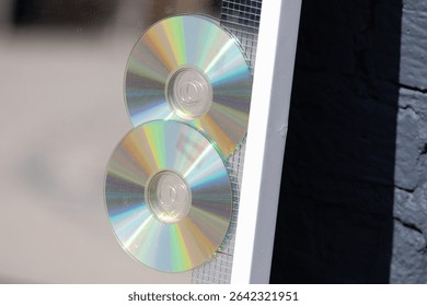 Two cd's on the mirror