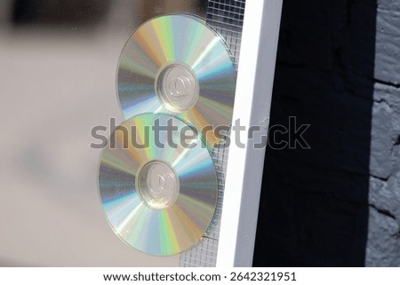 Two cd's on the mirror