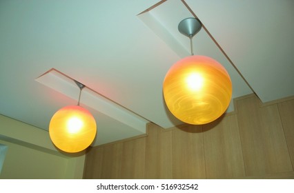 
Two ceiling lights in the form of balls