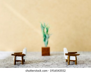 Two Chairs Facing In Opposite Directions