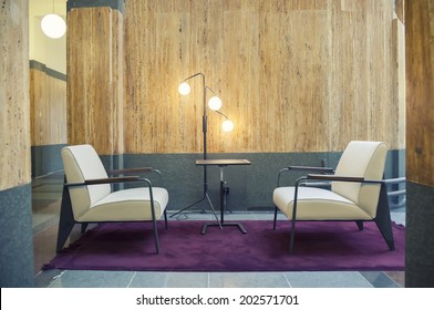 Two Chairs In Hall Of Office Building 