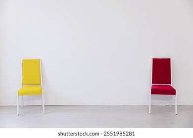 Two chairs in the interior of an empty white room