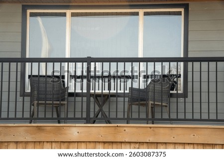 Two chairs placed on the second floor balcony, so the homeowner can rest and enjoy the view