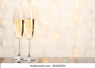 Two Champagne Glasses On Light Background