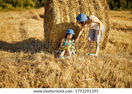 Similar – Vater und Sohn sitzen im Park.