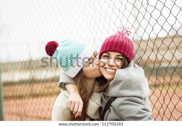 Two Cheerful Cute Teenage Girls Hugging Stock Photo Edit Now