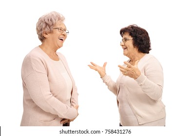 Two cheerful elderly women talking isolated on white background