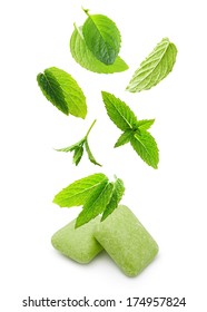 Two Chewing Gum With Mint Leaves On White Background.