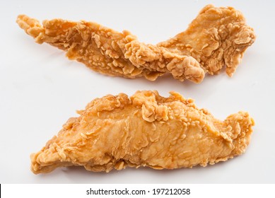 Two Chicken Fingers On White Background Isolated.