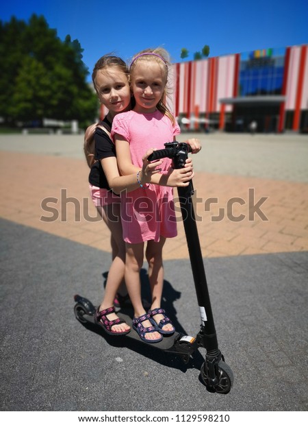 children on scooters