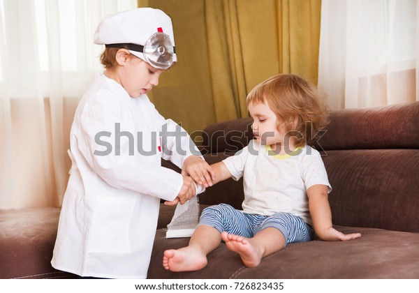 two children play doctor home smiling royalty free stock image children play doctor