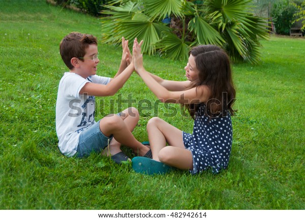 Two Children Playing Hand Clapping Game Stock Photo Edit Now 482942614