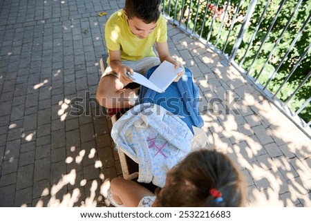 Similar – grandma reading a book to a child