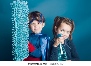 Two Children Super Heroes Helping To Clean